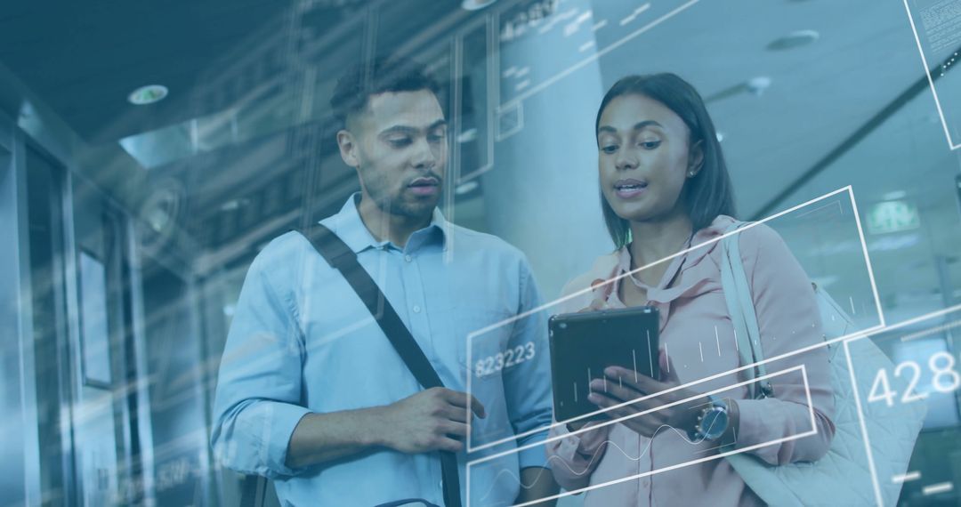 Colleagues Analyzing Digital Data on Tablet with Futuristic Interface