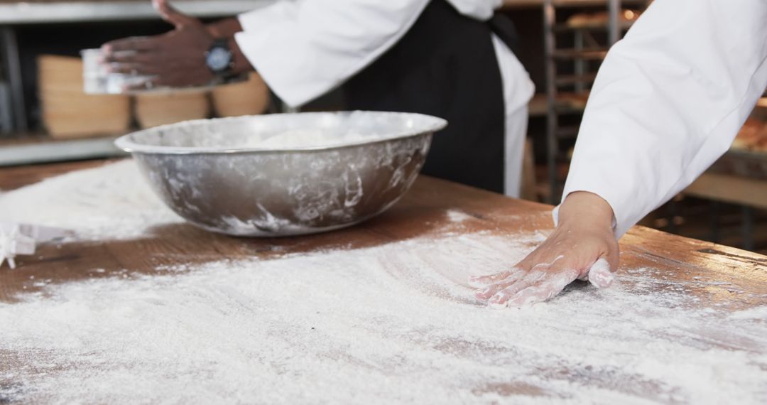 Chefs Preparing Dough on Floured Surface in Professional Kitchen - Free Images, Stock Photos and Pictures on Pikwizard.com