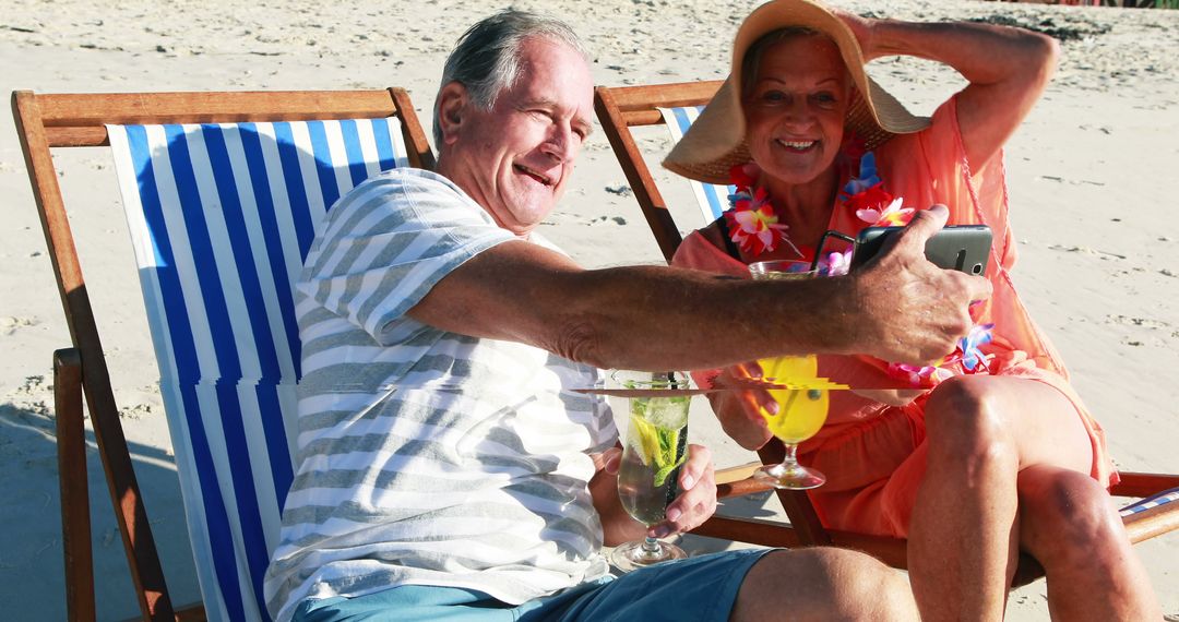 Senior Couple Taking Selfie Together on Beach Chairs - Free Images, Stock Photos and Pictures on Pikwizard.com