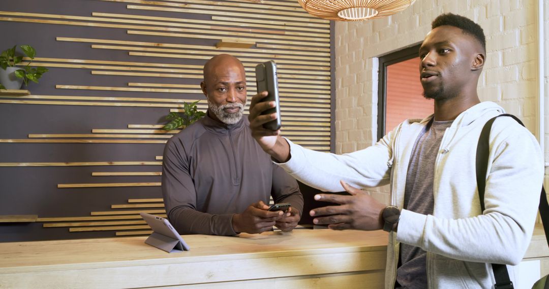 Tech Store Interaction: Discussing Digital Devices at Counter