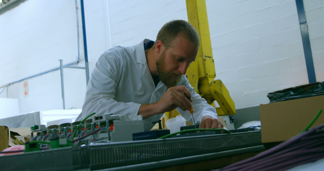 Engineer Conducting Quality Control in Modern Manufacturing Facility - Free Images, Stock Photos and Pictures on Pikwizard.com