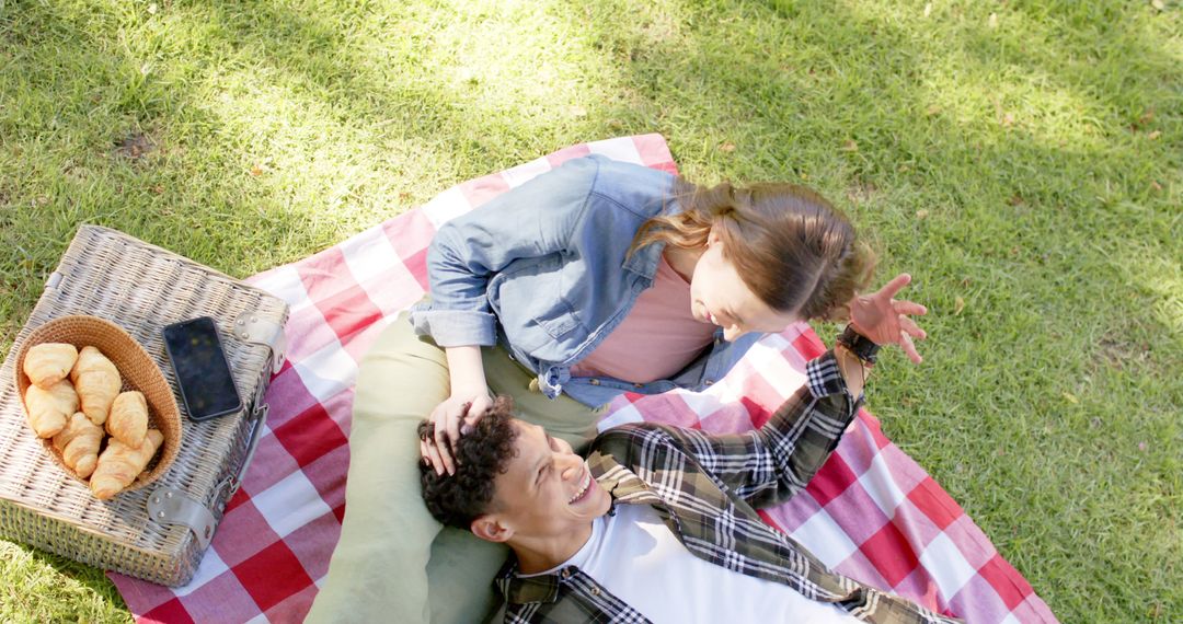 Happy Couple Enjoying Picnic on Sunny Day in Park