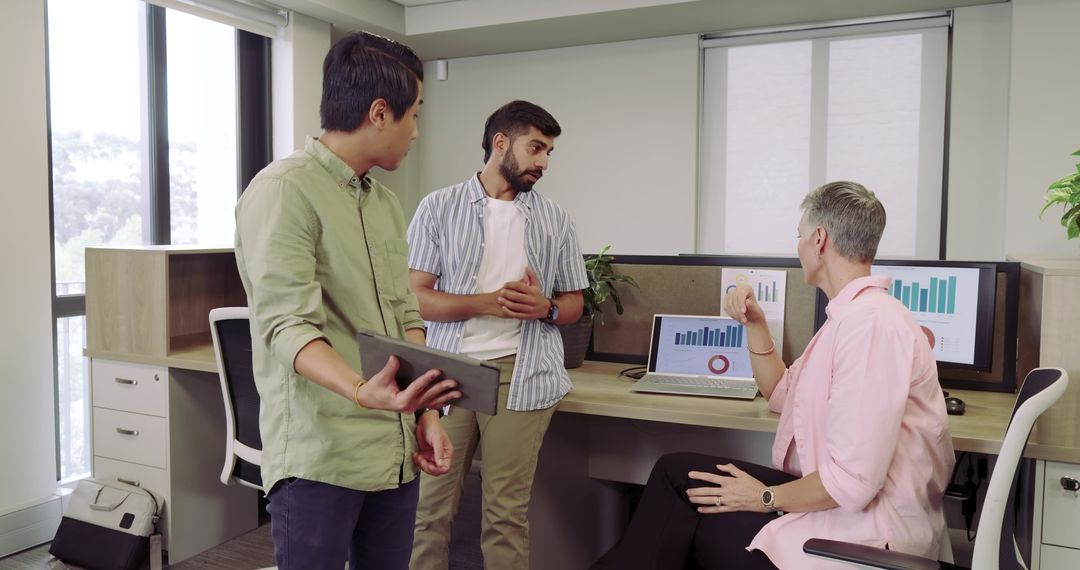 Collaborative Team Discussion in Modern Office with Data Analysis