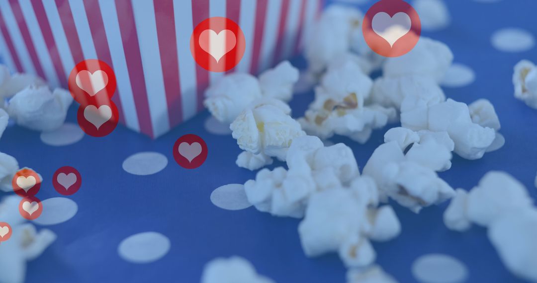 Popcorn Celebration with Floating Heart Icons on Polka Dot Background - Free Images, Stock Photos and Pictures on Pikwizard.com