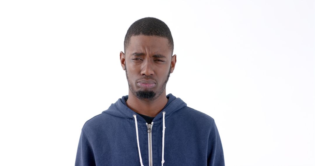 Confused young man in casual blue hoodie