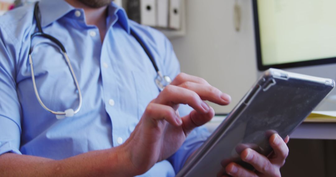 Doctor Using Tablet in Retirement Home Office Setting