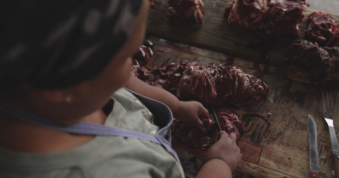 Butcher Cutting Raw Meat in Traditional Marketplace - Free Images, Stock Photos and Pictures on Pikwizard.com