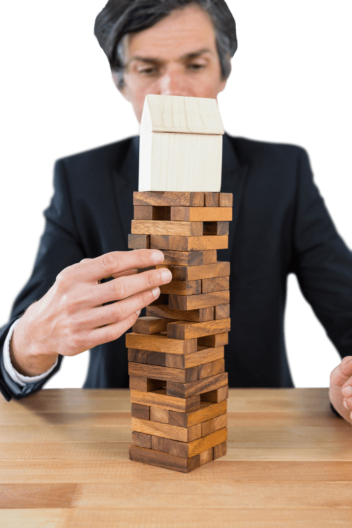 Businessman Strategically Stacking Transparent Wooden Blocks Tower