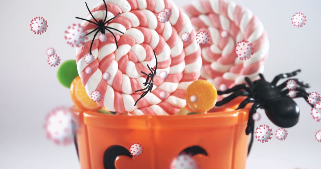 Halloween Candy with Spiders and Virus Symbols Floating Around