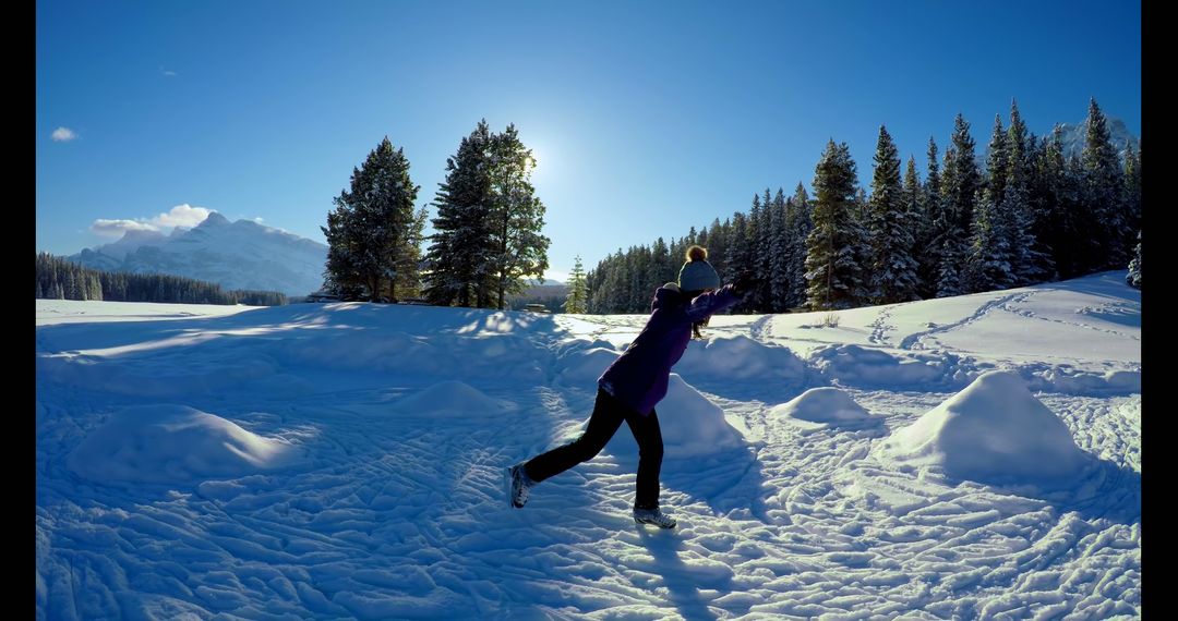 Woman Playing in Snow in Sunny Winter Landscape - Free Images, Stock Photos and Pictures on Pikwizard.com