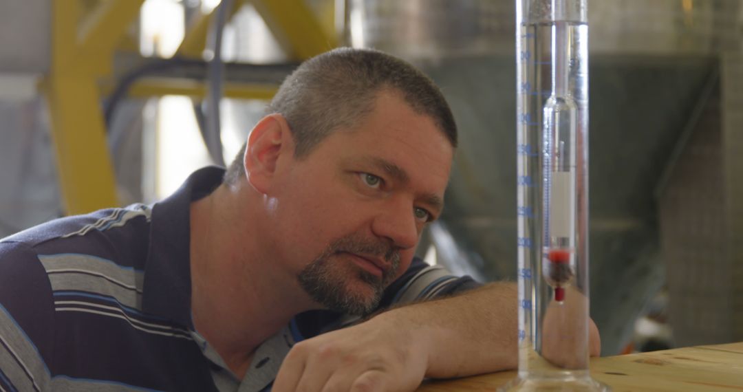 Scientist Observing Hydrometer for Liquid Measurement - Free Images, Stock Photos and Pictures on Pikwizard.com