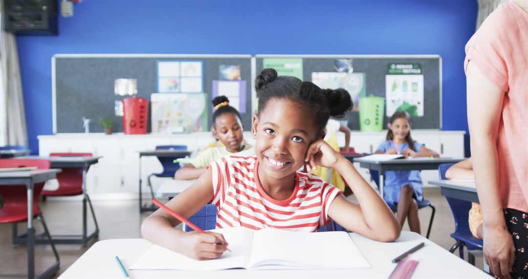 Smiling African-American Girl Studying in Classroom - Free Images, Stock Photos and Pictures on Pikwizard.com