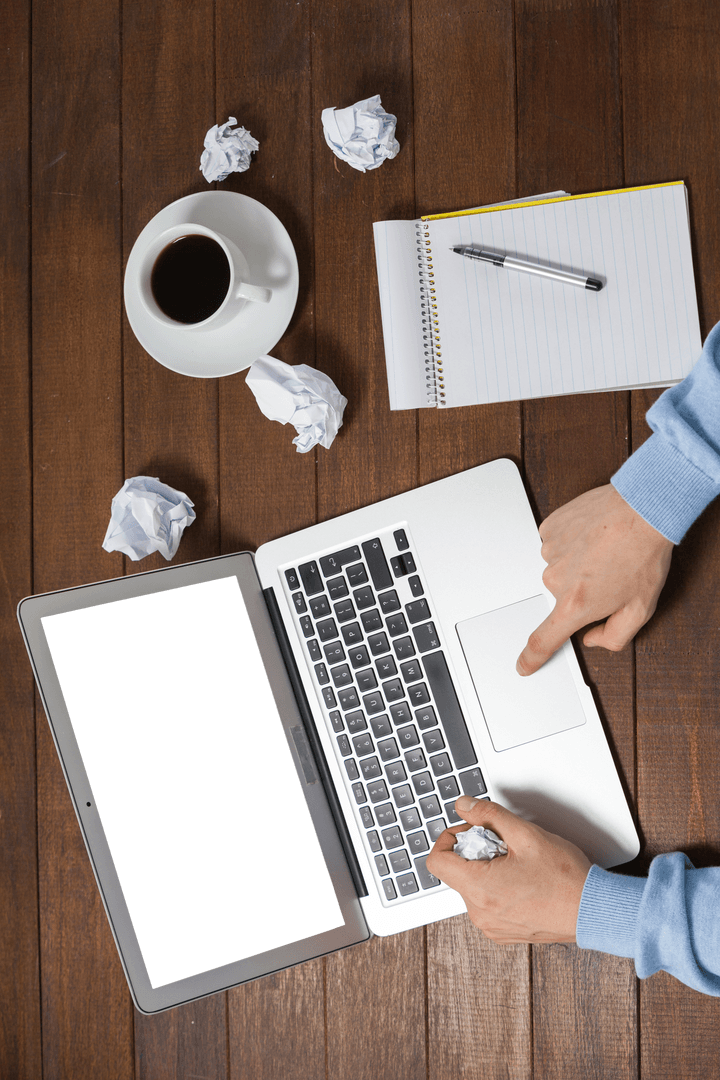 Overhead Transparent View Man at Laptop with Coffee Note and Crumpled Papers