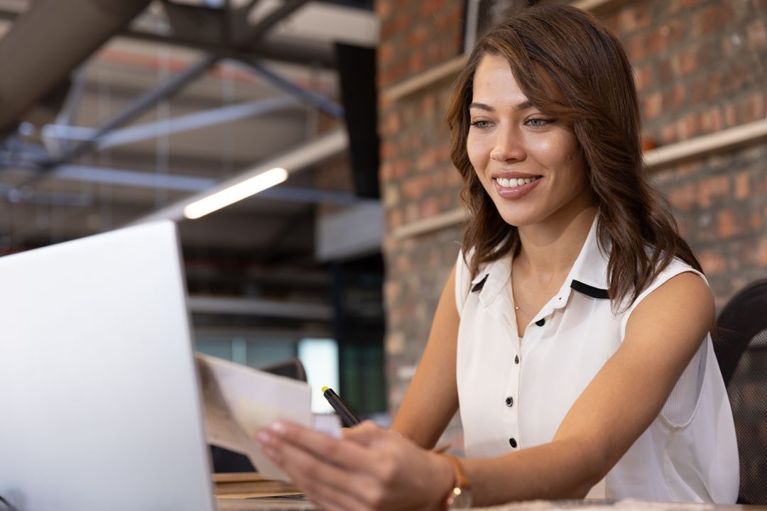 Professional Woman Reviewing Documents in Office Environment