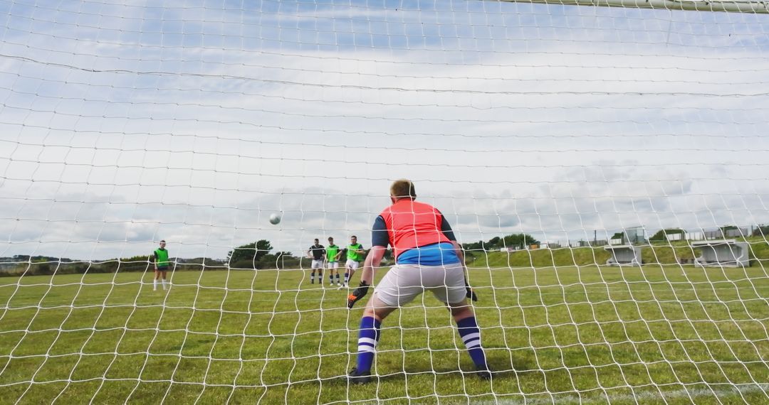 Goalkeeper Defending with Team Forming Protective Wall on Soccer Field