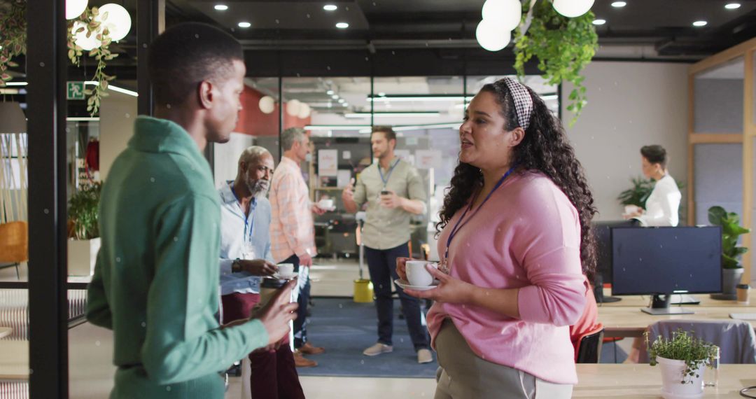 Office Workers Engaging in Conversation at Contemporary Coffee Break Area