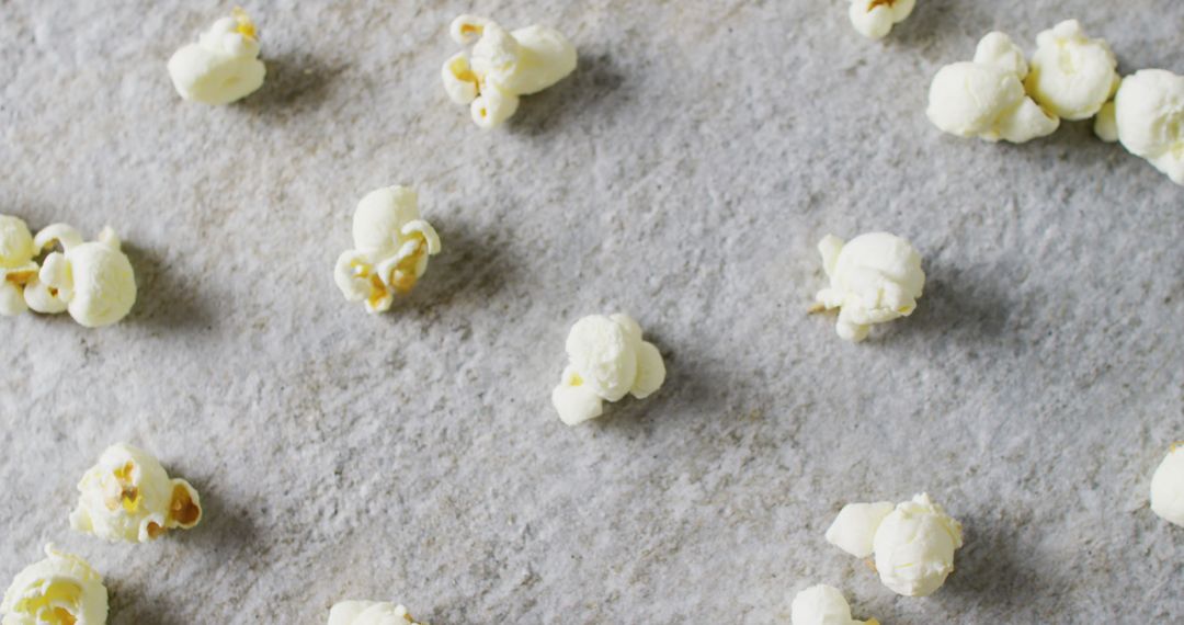Scattered Popcorn on Gray Background Texture