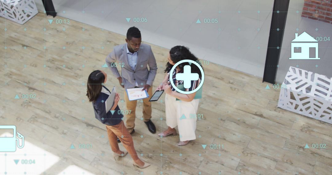 Diverse Team Discussing Eco Icons and Data Innovation in Modern Office