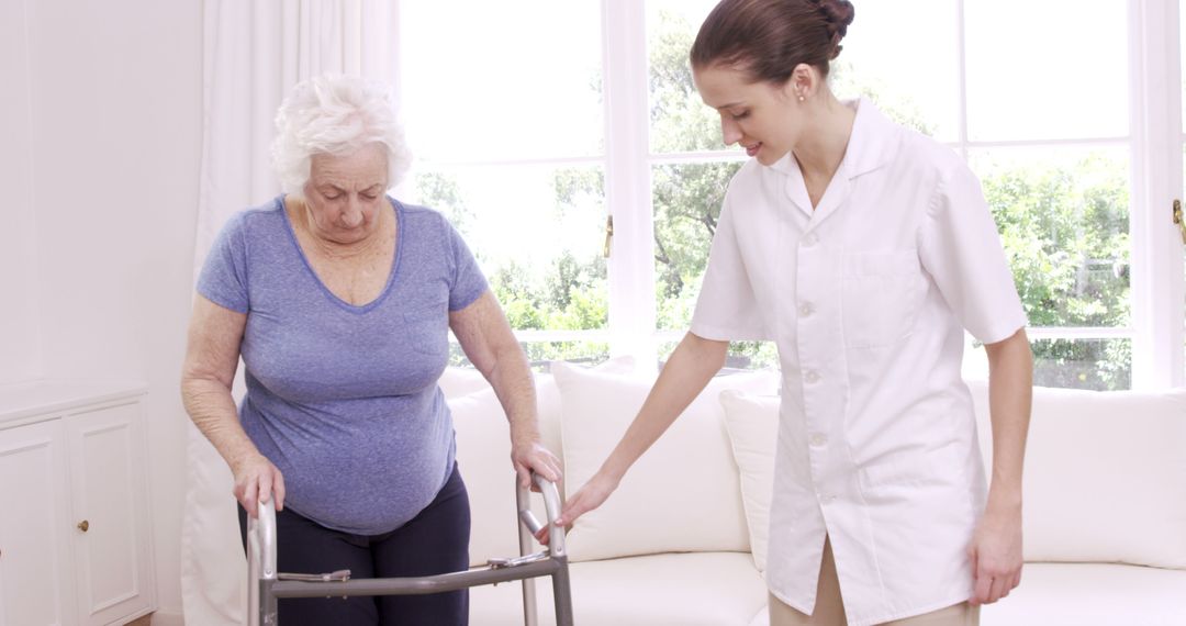 Caregiver Assisting Elderly Woman with Walker in Bright Room - Free Images, Stock Photos and Pictures on Pikwizard.com