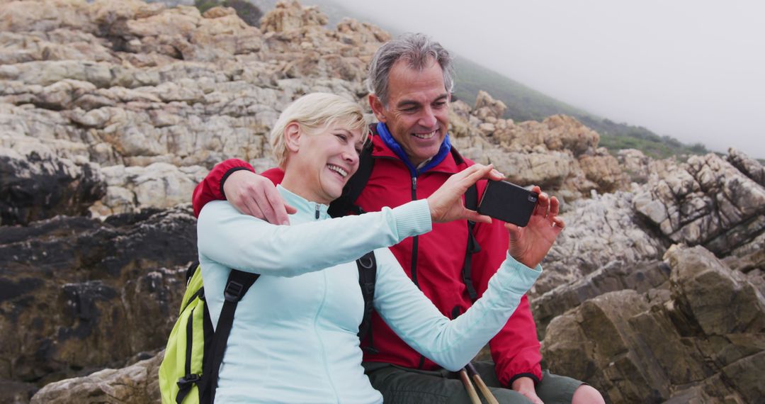 Happy Senior Couple Taking Selfie on Mountain Trail - Free Images, Stock Photos and Pictures on Pikwizard.com