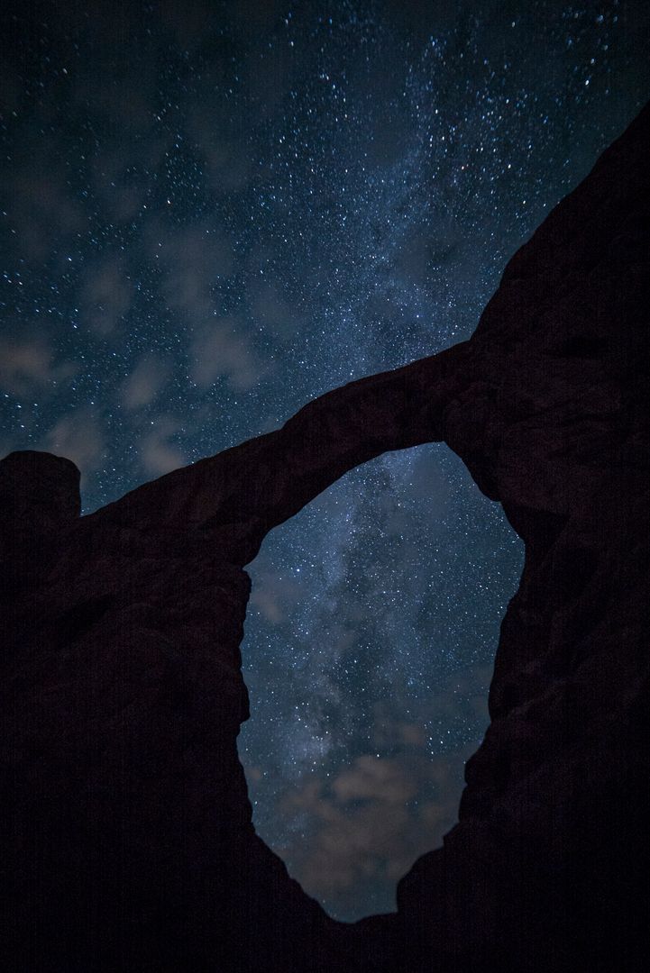 Silhouette of Natural Rock Arch Against Starry Night Sky - Free Images, Stock Photos and Pictures on Pikwizard.com