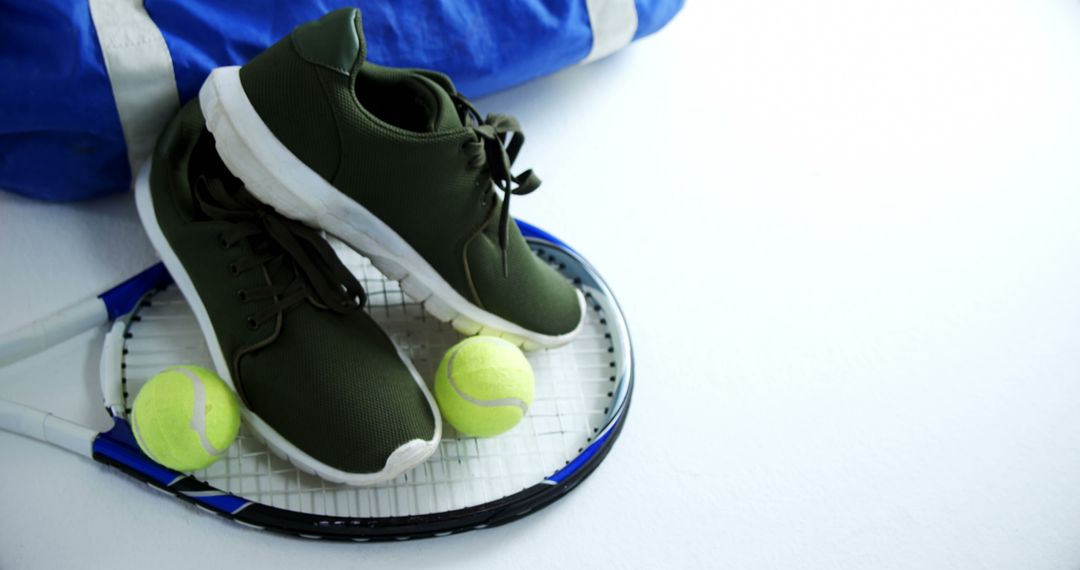 Sports Equipment with Tennis Shoes, Racket, and Balls at Court - Free Images, Stock Photos and Pictures on Pikwizard.com