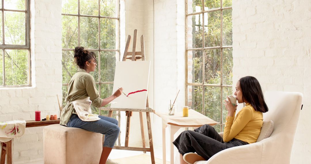 Friends Painting and Relaxing in Bright Art Studio