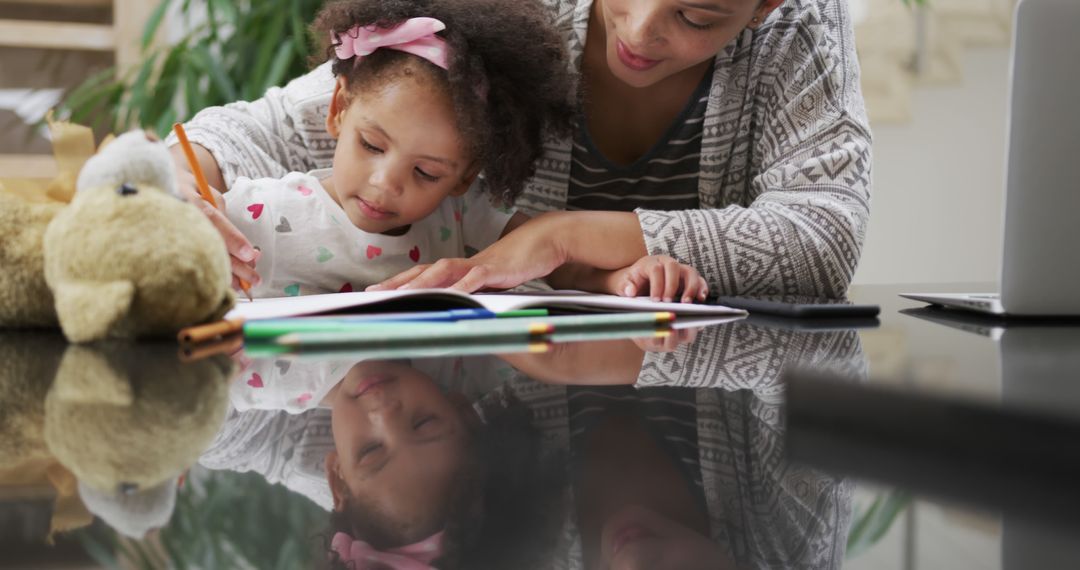 Mother Helps Young Daughter with Homework at Home - Free Images, Stock Photos and Pictures on Pikwizard.com