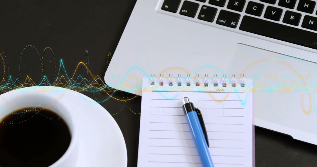 Laptop with Notebook and Pen on Desk, Symbolizing Data Processing