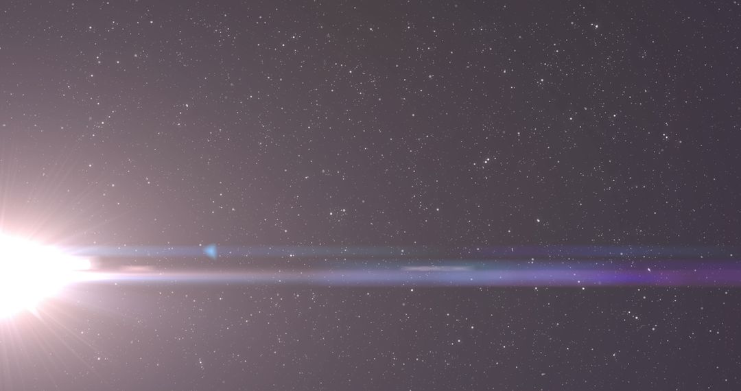 Starlit Sky with Brilliant Light Flare Displaying Cosmic Energy