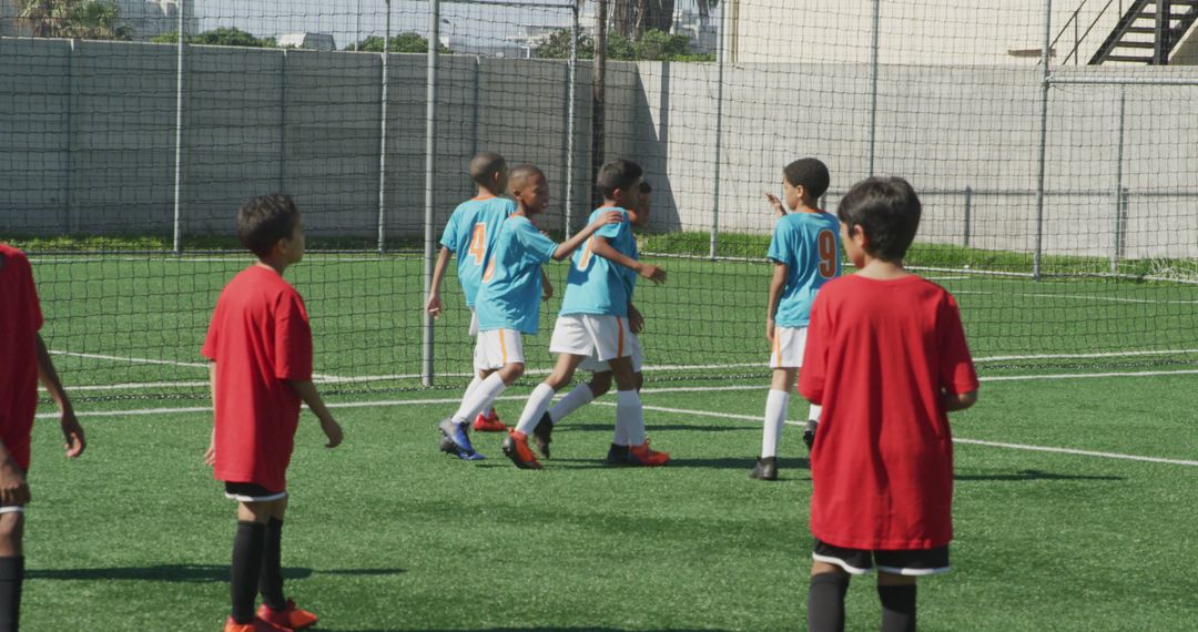 Young Soccer Players Celebrating Goal on Sports Field - Free Images, Stock Photos and Pictures on Pikwizard.com