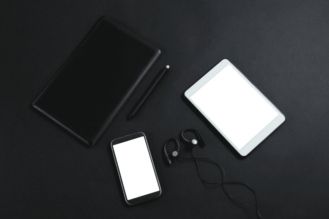 Transparent Electronic Gadgets on Dark Surface Overhead View