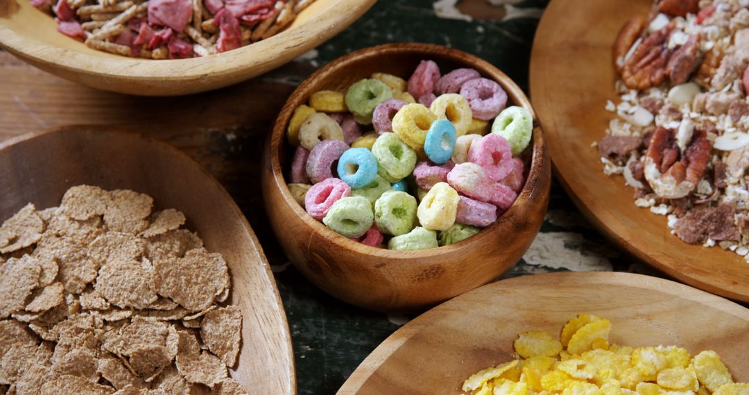 Assorted Breakfast Cereals in Wooden Bowls - Free Images, Stock Photos and Pictures on Pikwizard.com