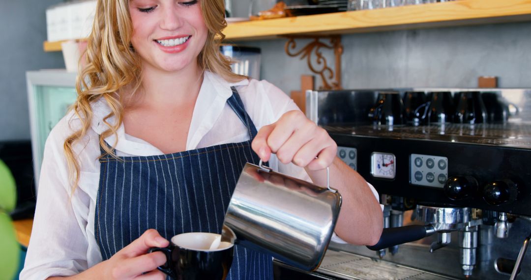 Smiling Barista Pouring Milk into Espresso Cup at Coffee Machine - Free Images, Stock Photos and Pictures on Pikwizard.com