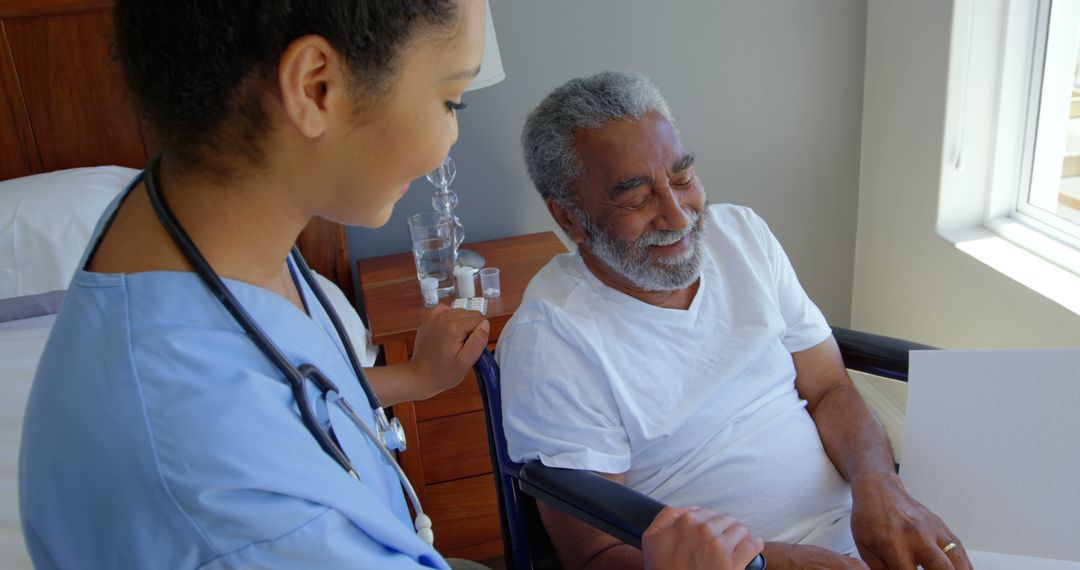 Nurse Providing Care to Senior Man in Wheelchair at Home - Free Images, Stock Photos and Pictures on Pikwizard.com