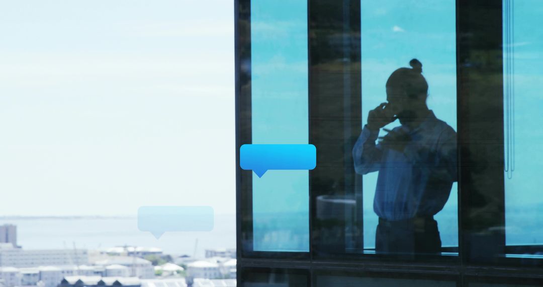 Businessman Talking on Phone by Office Window with Digital Chat Bubbles and City Skyline