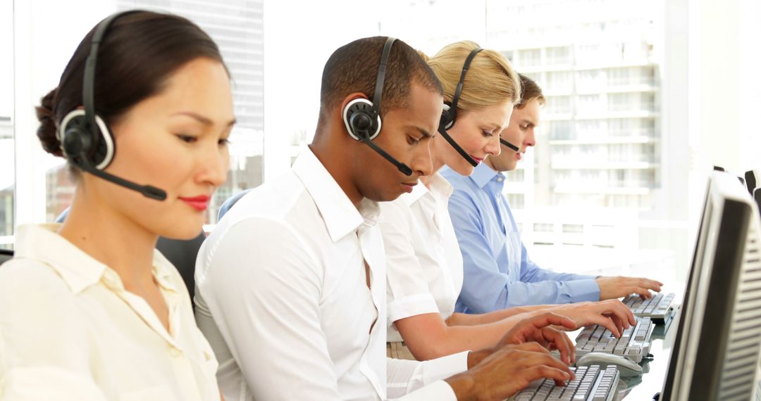 Diverse Call Center Team Using Headsets and Computers in Office - Free Images, Stock Photos and Pictures on Pikwizard.com