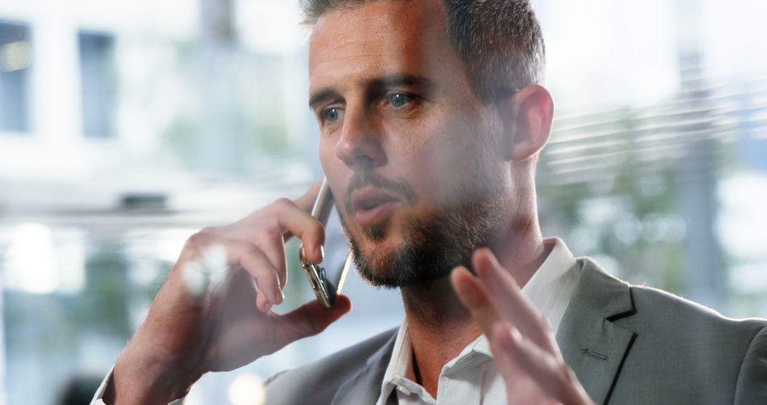 Confident Businessman in Office on Phone Call - Free Images, Stock Photos and Pictures on Pikwizard.com