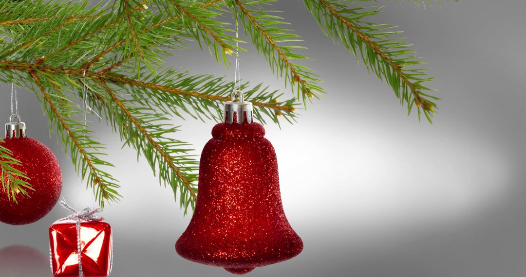 Festive Red Ornament Decor on Evergreen Christmas Tree Branch