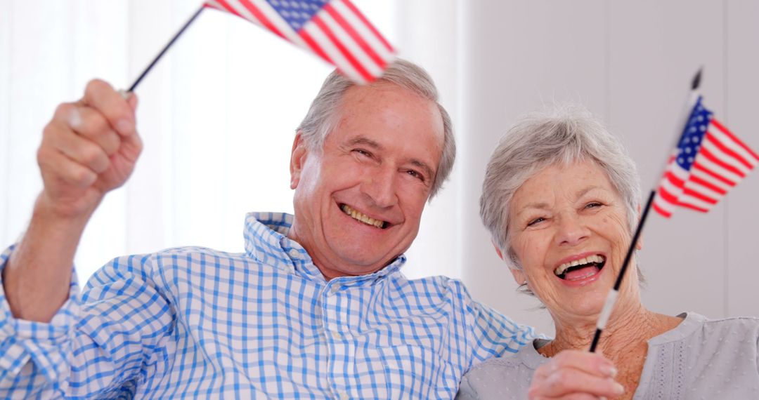 Senior couple holding american flag at home - Free Images, Stock Photos and Pictures on Pikwizard.com