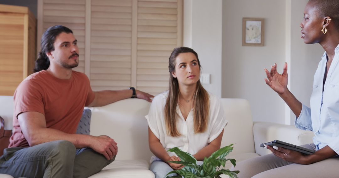Concerned Couple Having Serious Conversation at Home