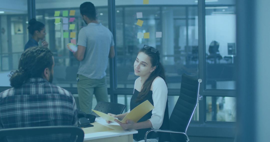 Modern Office Team Collaboration Meeting with Documents