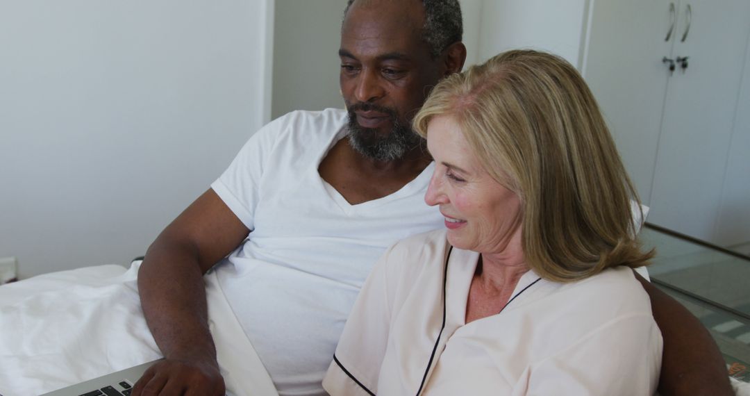 Senior Couple Engaging with Laptop in Cozy Home Setting