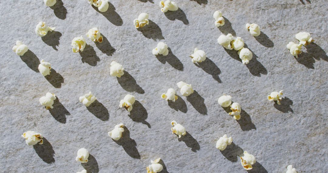 Patterned Popcorn with Shadows on Gray Surface