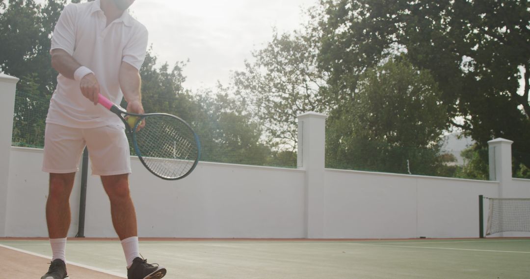 Senior Man Playing Tennis on Outdoor Court in the Afternoon - Free Images, Stock Photos and Pictures on Pikwizard.com