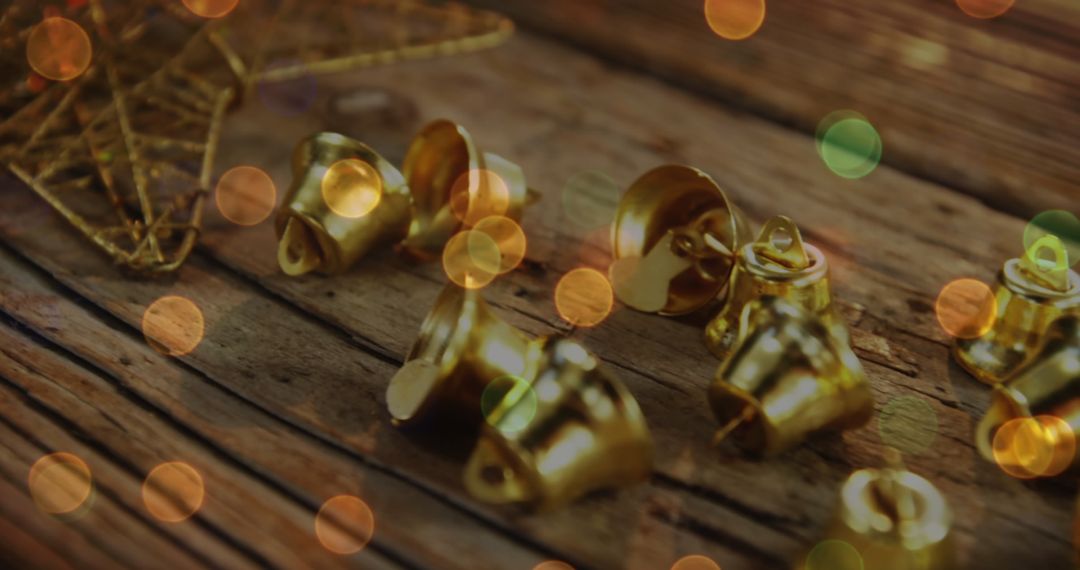 Christmas Gold Bells on Rustic Wooden Surface with Bokeh Effect
