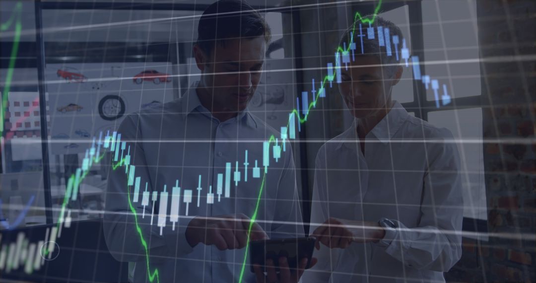 Business Professionals Analyzing Stock Market Graphs on Tablet - Free Images, Stock Photos and Pictures on Pikwizard.com