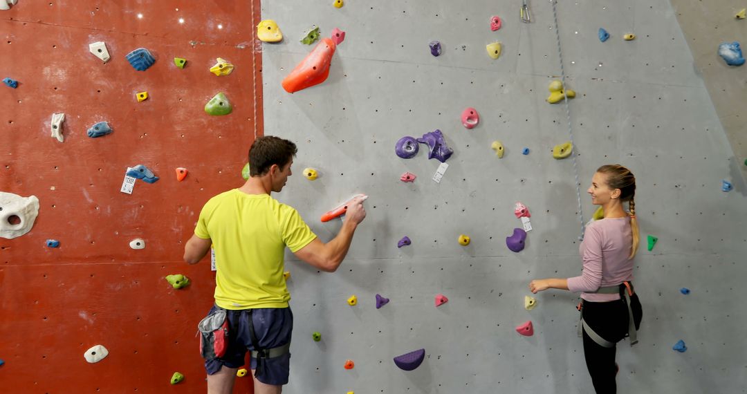 People Rock Climbing Indoors on Colorful Climbing Wall - Free Images, Stock Photos and Pictures on Pikwizard.com