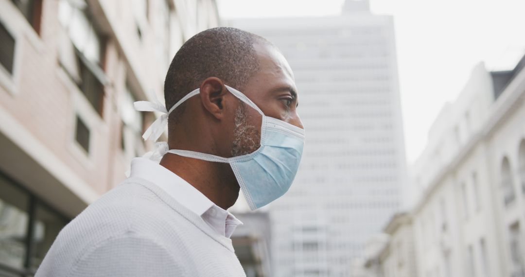 Man Wearing Face Mask in Urban Environment Against COVID-19