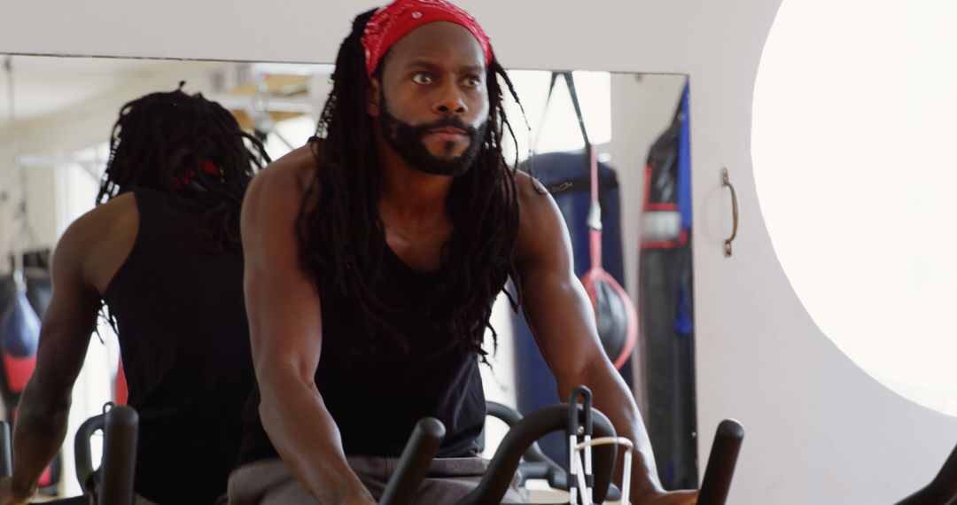 Boxer Training on Exercise Bike in Gym for Cardio